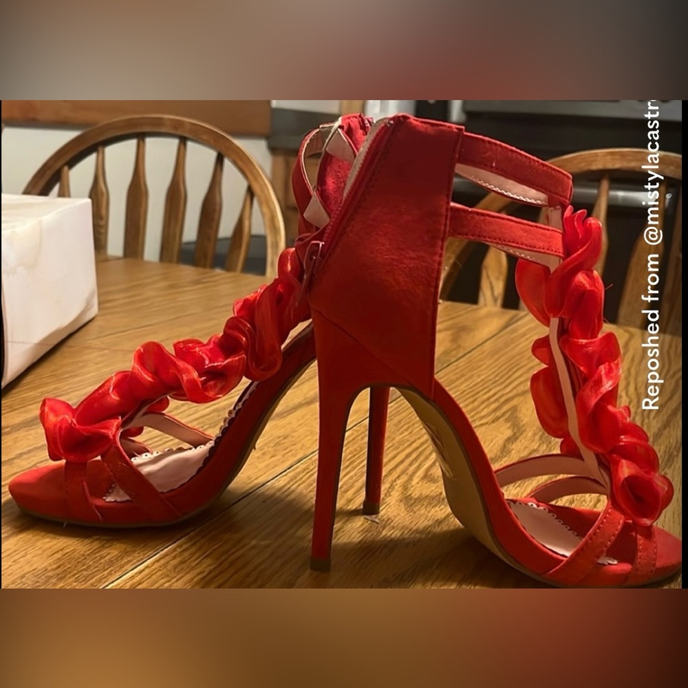 Red satiny heels with roses up front